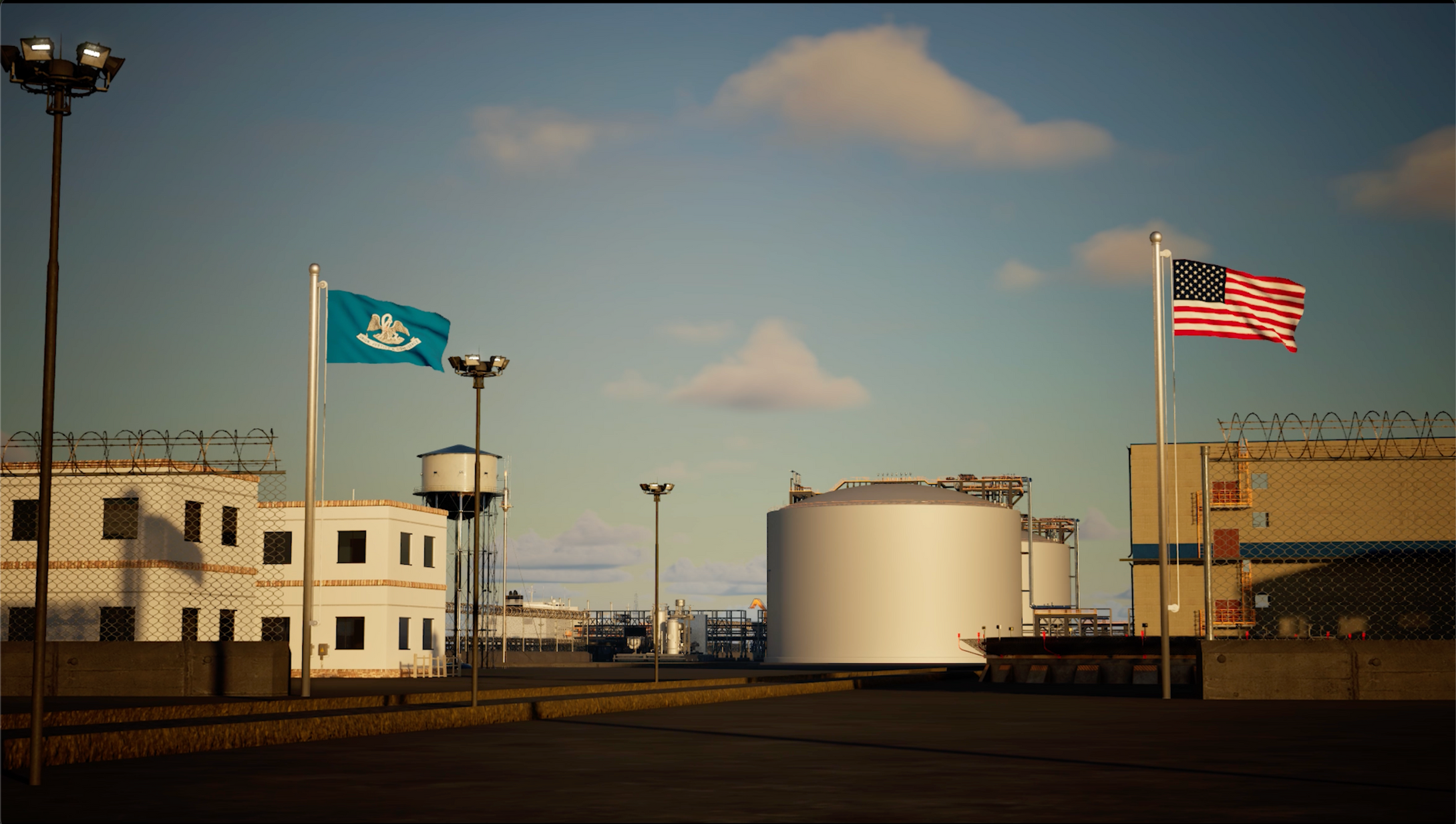 Oil storage tanks with American and state flags in the background