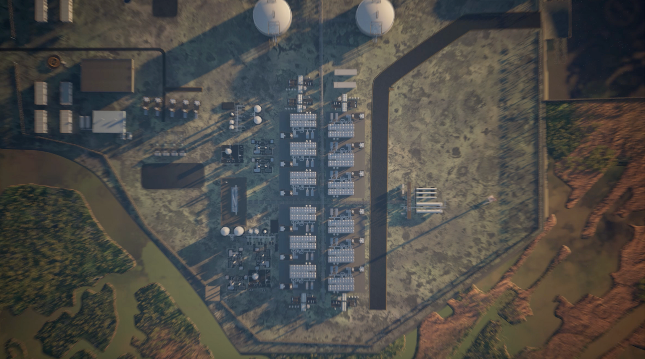 Aerial view of a large industrial complex with multiple buildings and structures.
